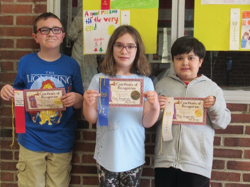 KIND KIDS: Winsor Hill students Owen Botelho (left), took second place in the school&rsquo;s Friendship Poster Contest while Finley Shavlier was first and Noah Guimmaraes placed third.