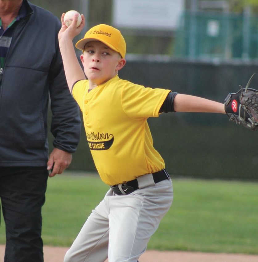DOING BATTLE: Calvino Law and 99 Restaurants of the Cranston Western Little League did battle in a recent game. Here&rsquo;s a look at the action. (Photos by Alex Sponseller)