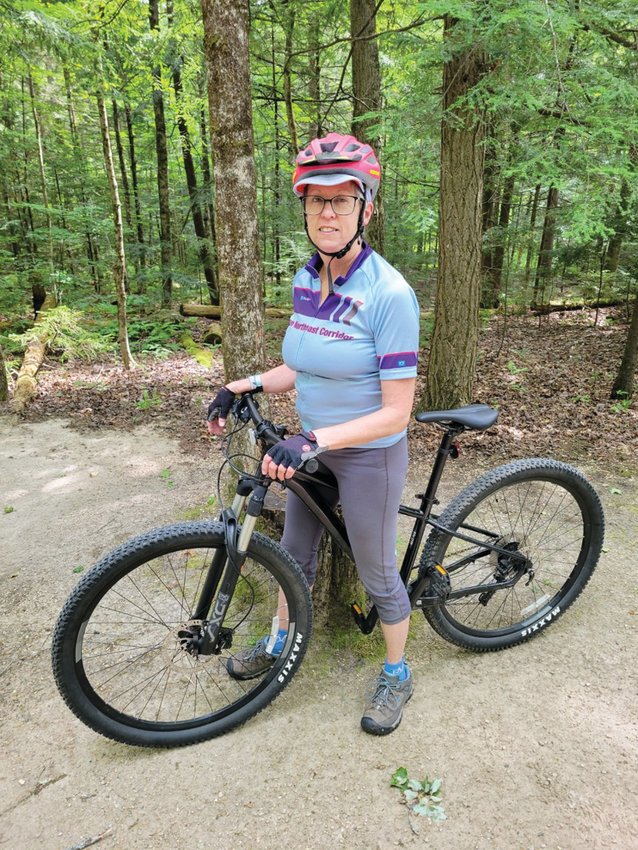 READY TO BIKE: Linda Burrows will participate in this year&rsquo;s Pan Mass Challenge (PMC) by biking from Wellesley to Patriot Place on a 50-mile route. Her goal each year is to increase the distance she rides within the race. Here she is biking in Vermont three weekends before PMC. (Submitted photo)
