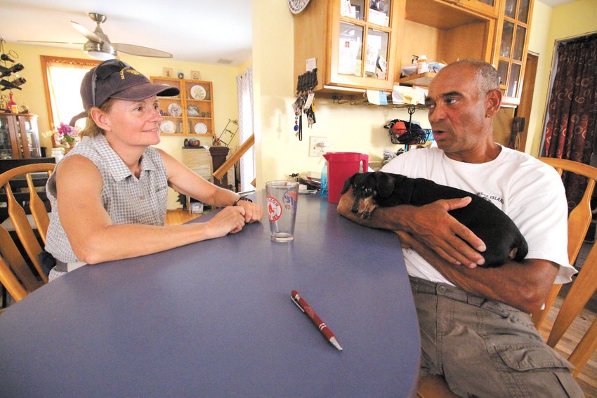 FEELING AT HOME: Filmmaker Karin Muller and Jody King of Warwick outline plans for a day of shooting at King&rsquo;s kitchen counter. (Warwick Beacon photos)