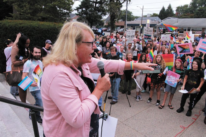 LOUD AND CLEAR: Rev. Dr. Donnie Anderson was among those who addressed the protestors from the steps of the library. Anderson, who said trans rights are human rights, implored the crowd to shout their affirmation loud enough so that those meeting inside the library could hear them. (Herald photos)