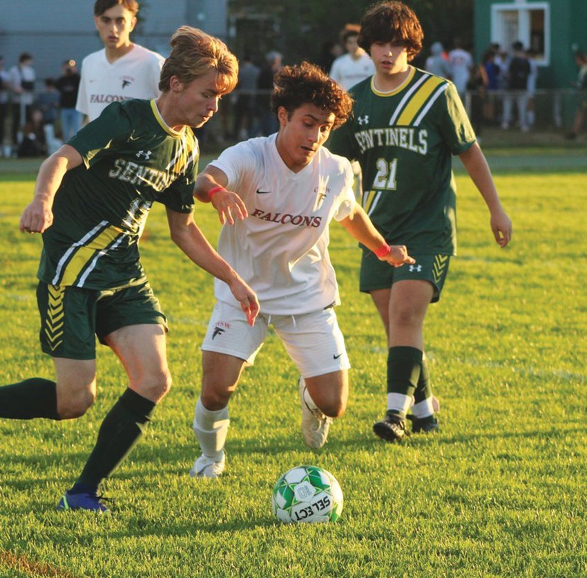 KEEPING PACE: West&rsquo;s Abraham Baldomar battles Smithfield defenders. (Photos by Alex Sponseller)