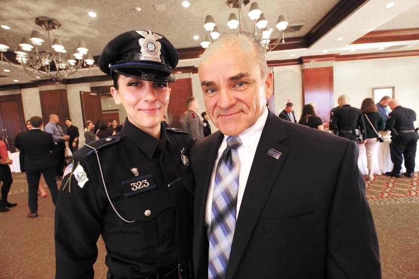 DAD AND DAUGHTER: Retired Rehoboth, MA, police chief Stephen Enos with his daughter and Warwick Police officer Keara Enos, who MADD Rhode Island named rookie of the year at an awards breakfast Friday. (Warwick Beacon photos)
