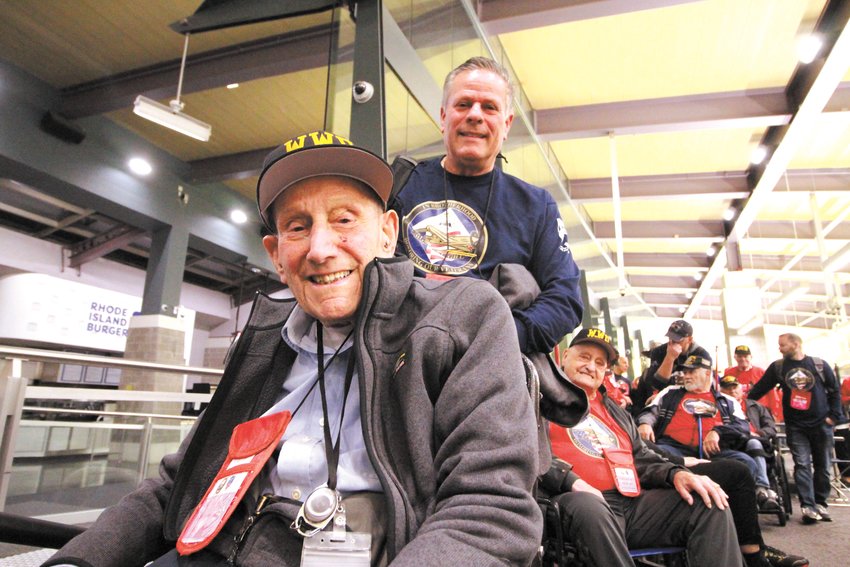 READY FOR A FULL DAY: World War II Army veteran Rocco Marcaccio, 101, was accompanied by his son, Paul, during the honor flight. Marcaccio and WWII veteran Roland Theroux placed a wreath at the tomb on the Unknown Soldier at Arlington National Cemetery on Saturday.