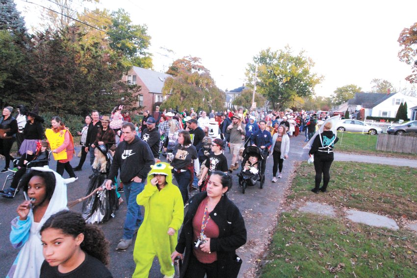FILLING THE STREET: From curb to curb and stretching at least two blocks, the parade snaked through Greenwood. (Warwick Beacon photos)