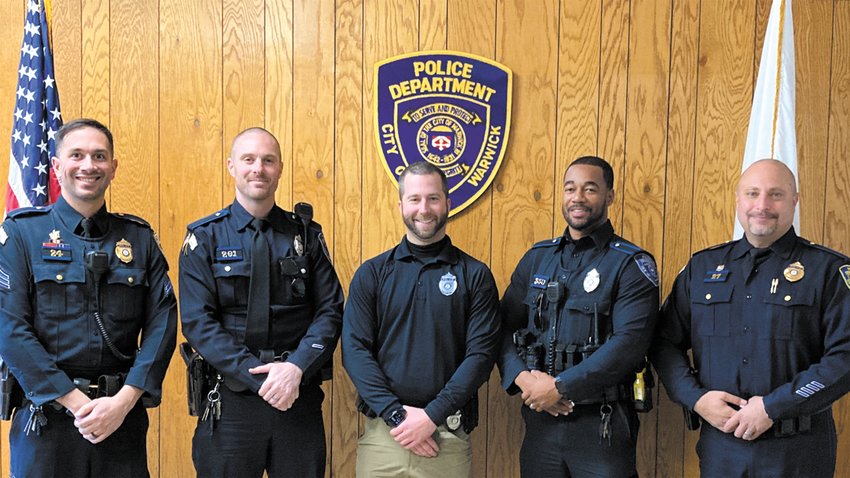 SANTA IN THEIR MIDST? Sargent Jason Brodeur, Officer Mike Isherwood(traffic division), Community Police Officer Ryan Shipley, Patrol Officer Rahja Laster and Sargent Matt Moretti haven&rsquo;t had a razor encounter since the first of the month and it&rsquo;s showing. (Warwick Beacon photo)