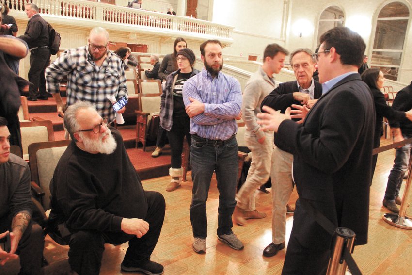 WHAT&rsquo;S IT MEAN? Ward 9 Councilman Vincent Gebhart addresses the questions of Gerald Galleshaw as landlords congregate at the end of Monday&rsquo;s hearing of an ordinance that would control Airbnbs. (Warwick Beacon photos)