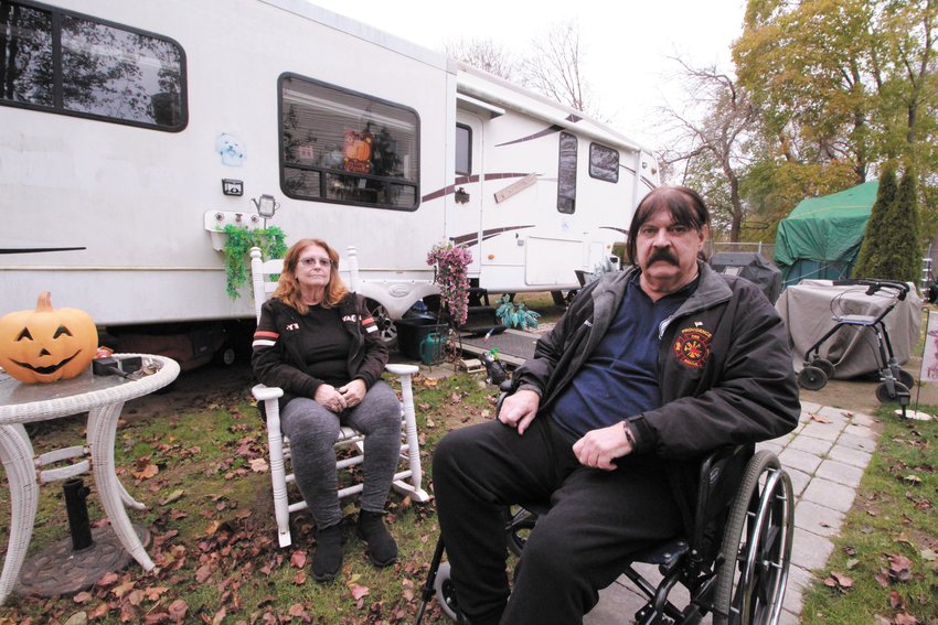 HOME AWAY FROM HOME:  Sharon Roy and Charles Scott outside the trailer on the Tidewater Drive property Scott owns in Warwick. Scott has been told he can stay in the trailer as long as he doesn&rsquo;t go to sleep. (Warwick Beacon photos)