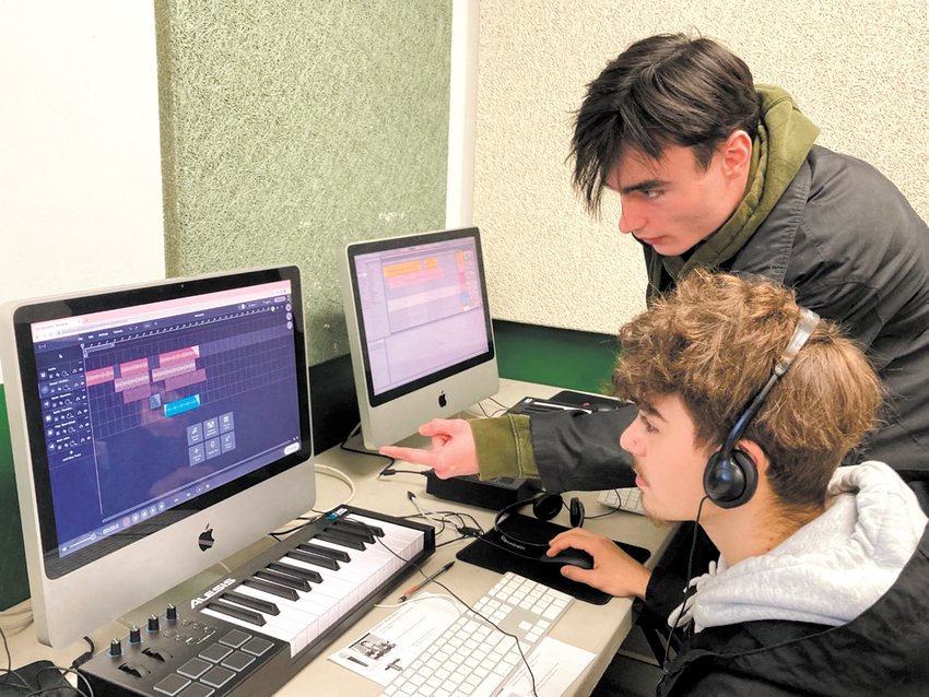 ALL AUDIO: Braidin Shaw (sitting) and Mitch Carpenter work on audio production at Cranston East. (Herald photo)