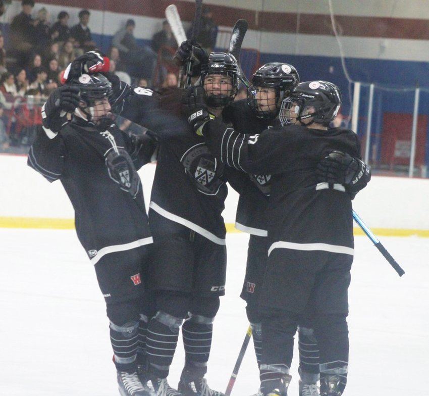 CLIMBING THE RANKS: Members of the Warwick boys hockey co-op celebrate a goal. (Photos by Alex Sponseller)