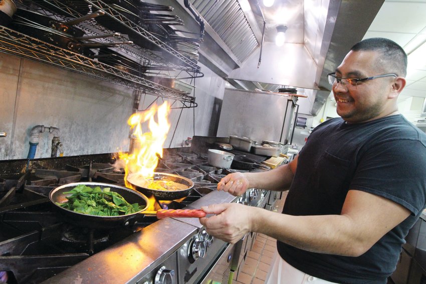 HE&rsquo;S GOT GAS: Silvan Garcia, head chef at the Governor Francis Inn works his wonders with the help from an efficient crew at the multi-gas-burner stove.