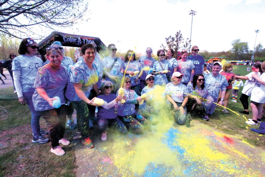 TEACHERS ACT UP: Warwick Neck Elementary School PTA held its major fundraiser of the year &ndash; a colorthon &ndash; Saturday at Confreda fields in Conimicut. The kids ran a course where they were dusted in colored corn starch and when that was over things got somewhat hectic as teachers joined in the fun. Even as they and Principal Galligan gathered for a group photo, some couldn&rsquo;t resist firing shots of color. Story and more photos on page 27.