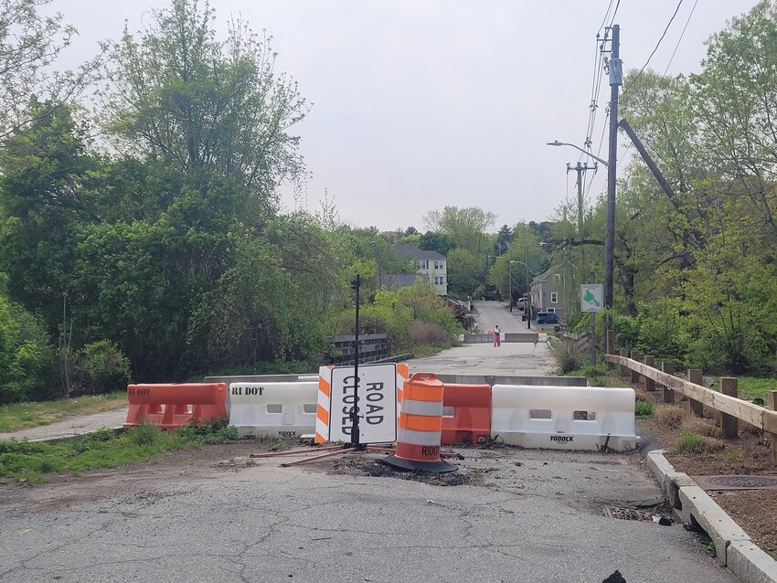 GO BACK THE WAY YOU CAME: Orange barricades, erected by RI DOT, block both sides of the Greystone Sluiceway Bridge on the border of Johnston and North Providence.