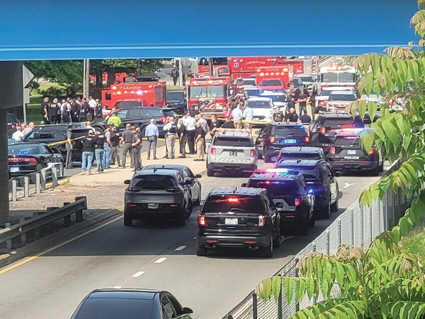 HEAVY POLICE PRESENCE: Police from multiple departments converged on a shooting suspect&rsquo;s car along Plainfield Pike, on the Johnston/Cranston border, early Wednesday morning.