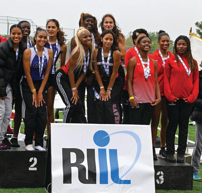 STATE CHAMPS: The Cranston West relay team of Ailani Sutherland, Quiana Pezza, Amelya D&rsquo;Errico and Praise Mayson on top of the podium after winning the state title in the 400. (Photos by Leo van Dijk/rhodyphoto.zenfolio.com)