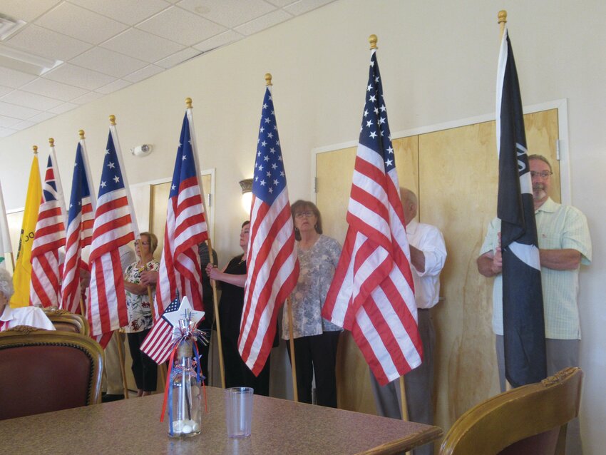 HISTORIC HAPPENING: Eight members of the Tri-city Elks carried these flags into the JSC&rsquo;s all-purpose room during the Flag Day ceremony.