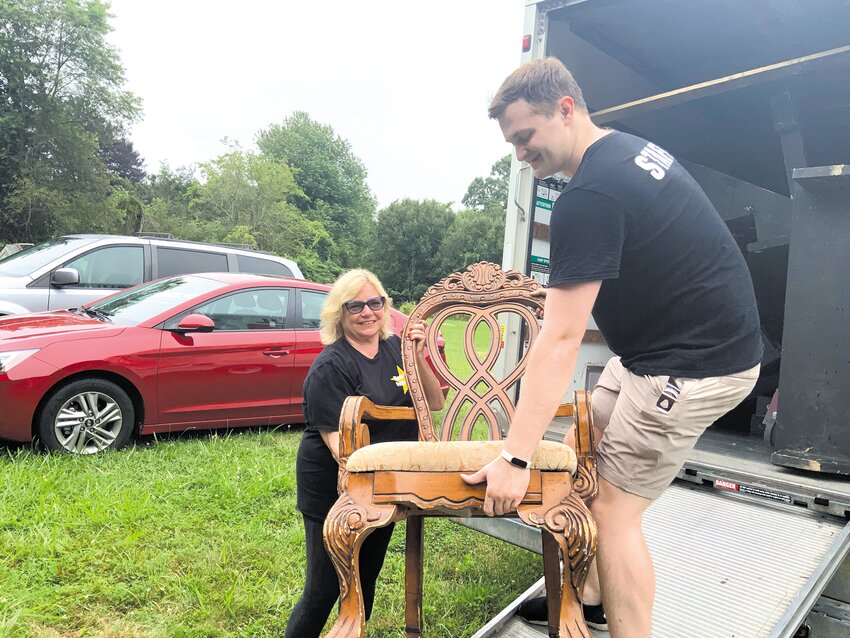 BEHIND THE SCENES: RIYT founder Ann O&rsquo;Grady helps unload furniture for a set with Cooper Cardone, a second generation staff member whose mother started with the company in 1987.  (Submitted photos)