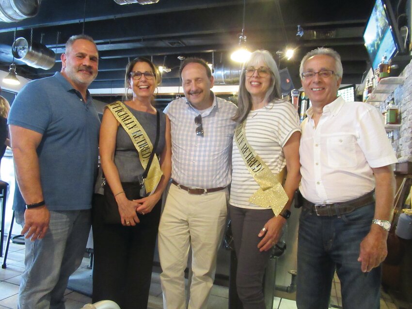 SPECIAL SENDOFF: Julie-anne Zarrella and Brenda Lee Troia are all smiles and joined by Johnston School Committee Vice Chairman Joe Rotella, Superintendent of Schools Dr. Bernard DiLullo Jr. and School Committee Chairman Bob LaFazia during last Wednesday&rsquo;s retirement party.