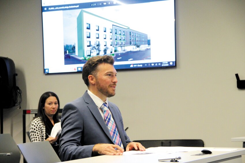 MAKING A CASE: Attorney Joseph Brennan of Brennan Law appeared before the Planning Board representing Gold Coast Properties seeking major land development approval for a 124-room Echo Suites extended stay hotel on Post Road across from the airport on Sept. 13. The board approved the development. Also pictured is Dana Nisbet, PE, from DiPrete Engineering. (Warwick Beacon photo)