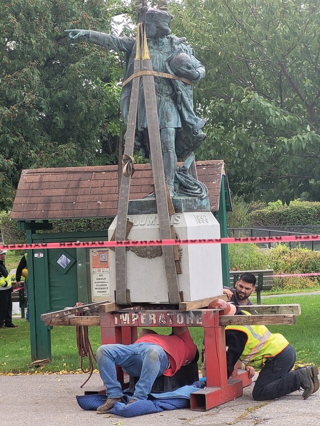 COLUMBUS BY CRANE: The Christopher Columbus statue that stood in Providence for 130 years has been erected on a cement pedestal on the island in the center of Johnston&rsquo;s War Memorial Park pond. The mayor has planned a Columbus Day unveiling event.
