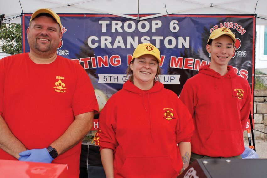 BEING A TROOPER: Ward 5 Councilman, and assistant scoutmaster, Chris Paplauskas, Scoutmaster Mariah Keenan and Senior Patrol Leader and Eagle Scout Aidan Paplauskas sell popcorn to raise money for Troop 6 Cranston.