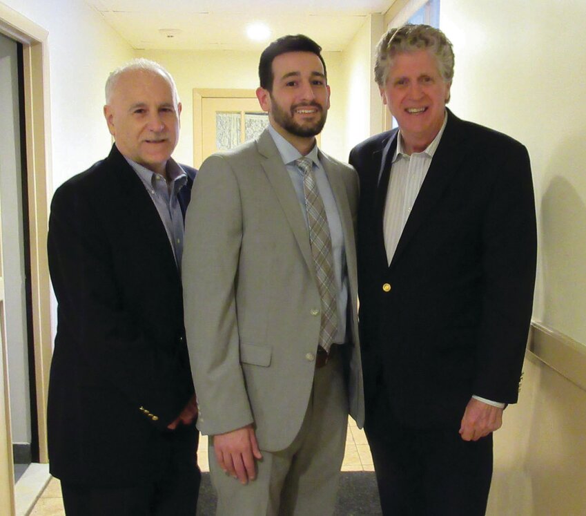 HAPPIER TIMES: Former Johnston Mayor Joseph Polisena Sr. and his son Joseph M. Polisena Jr. posed with then-Lt. Gov. Dan McKee at the younger Polisena&rsquo;s first political fundraiser in 2019. McKee went on to become Rhode Island&rsquo;s governor and Polisena succeeded his father as mayor. A fissure seems to have formed between the pair of former political allies and &ldquo;family friends.&rdquo;