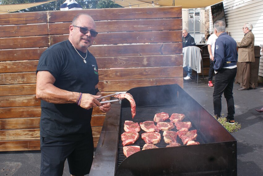 COOKING IT UP: Steak Chef Bobby Battista runs the grill and takes on the responsibility of all steak preparation.