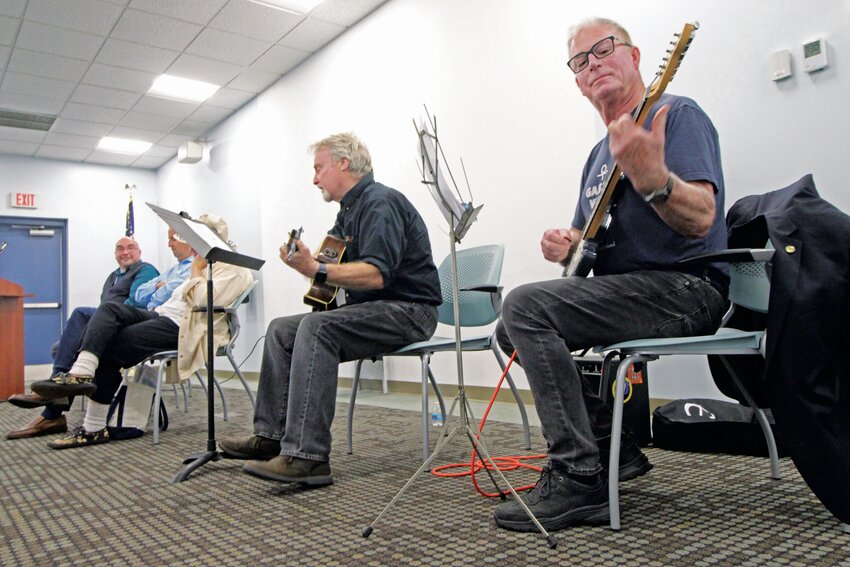 ROCKING THE GASPEE: John Foley and Rep. Joe McNamara on guitar teamed up to play McNamara&rsquo;s composition during the opening of the Gaspee display at the Warwick Library on Saturday. (Warwick Beacon photos)