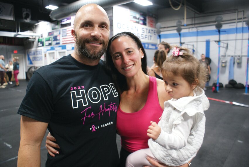 STANDING STRONG: Owner of the gym David Ward-Smith smiles with his wife Amanda and their daughter, 17-month-old Alessandr.