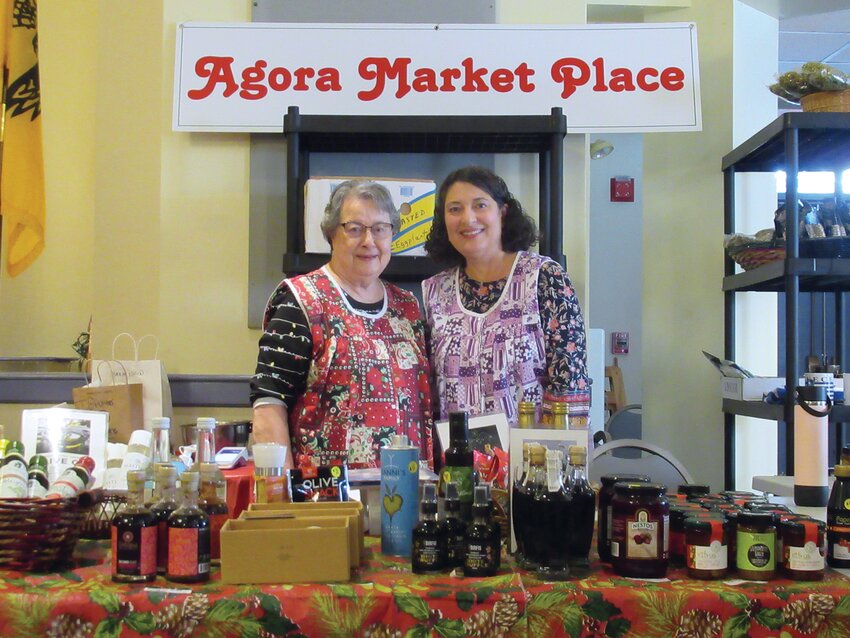 GREEK GOODIES: Maria Coclin and Denise Grammas are all smiles while staffing the Agora Market Place during last weekend&rsquo;s Greek Food Fair and Christmas Bazaar.