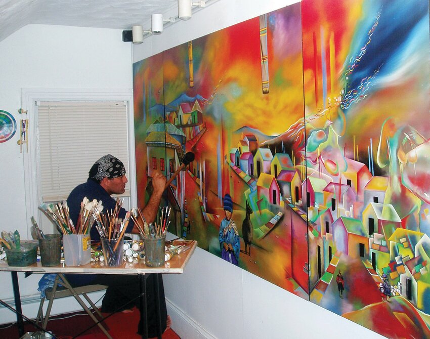 Nilton Cardenas working on a painting called &quot;I'm From There But I'm Not There.&quot; from his series entitled Native Land.