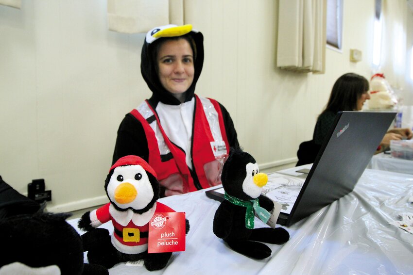 DRESSED AS A PENGUIN: Laura Callahan, disaster program specialist at the American Red Cross was present to promote its home fire preparedness campaign dressed as Pedro the Penguin. She said the Red Cross has installed 374 alarms and brought its training program to 172 homes since the first of the year.