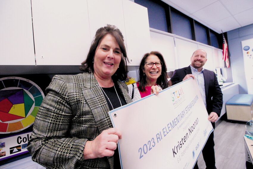 CAUSE FOR CELEBRATION: Kristen Noonan (left) poses with Lisa Bain of the Rhode Island STEAM Center and Ted Kresse of Rhode Island Energy as they present her with the award. (Warwick Beacon Photos)
