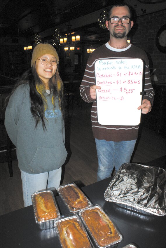 OUT OF THE PAN: Advocacy advisor Amy Southerland along with Kellen Moran man the bake sale table