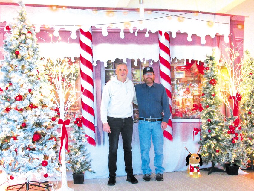 PASTOR&rsquo;S PAL: Pastor Allen Pangburn (left) joins Stan Winman amid many of the extraordinary Christmas Light Spectacular inside Praise Tabernacle in Cranston.