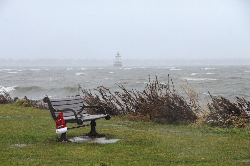 HE FORGOT HIS HAT: Tis the season for Santa, but he didn&rsquo;t linger at Conimicut Point Monday morning as winds neared 70 MPH and wind-driven spray mixed with sleeting rain. This photo was taken about 8:30 before a rising tide and storm surge forced the park&rsquo;s closure. (Warwick Beacon photos)