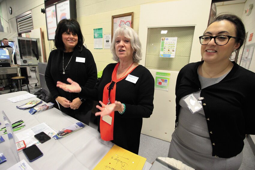 WAVE TEAM: WAVE employees Debra Baribault, Marie Morrell and Georgette Shamoun who visited financial literacy classes prior to the fair were on hand to assist students.