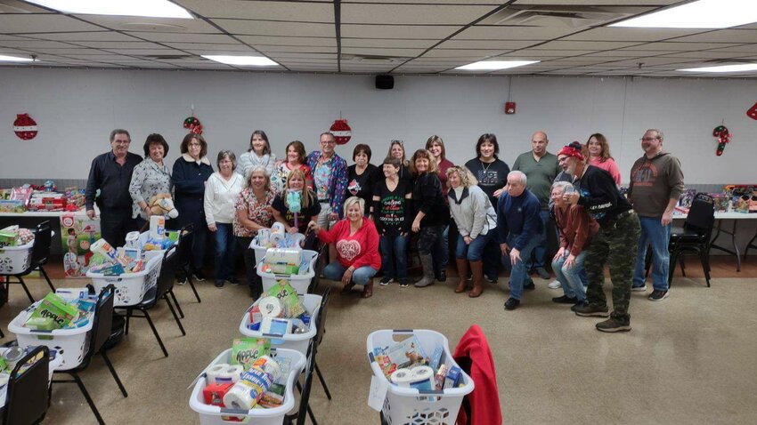 VALUABLE VOLUNTEERS: These are members of the Tri-City Elks Lodge 14 who filled a record 53 food baskets and countless giant plastic bags with toys and more that were given to area families so they could have a Merry Christmas.