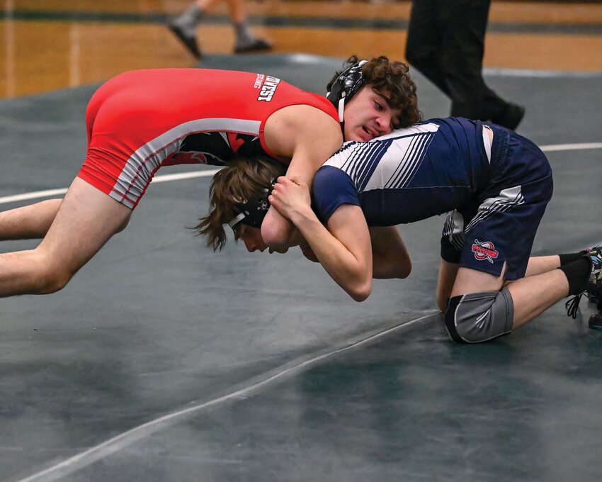 HITTING THE MATS: Cranston West&rsquo;s Kenny Negron grapples with an opponent in a recent match.