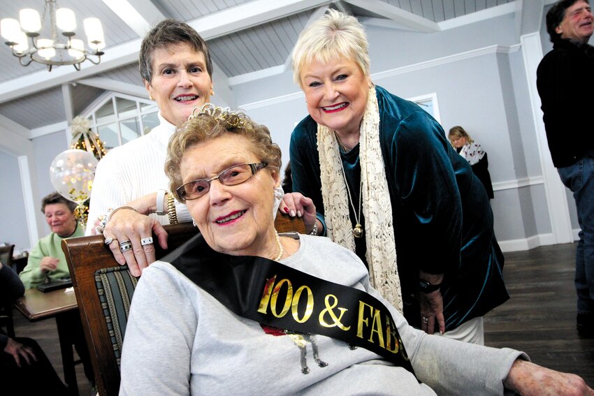 MOTHER AND DAUGHTERS: Gloria DiFolco, who turned 100 on Christmas Eve with her daughters, Lisa (left) and Patricia at Saturday&rsquo;s birthday party at Halcyon at West Bay assisted living. (Warwick Beacon photo)