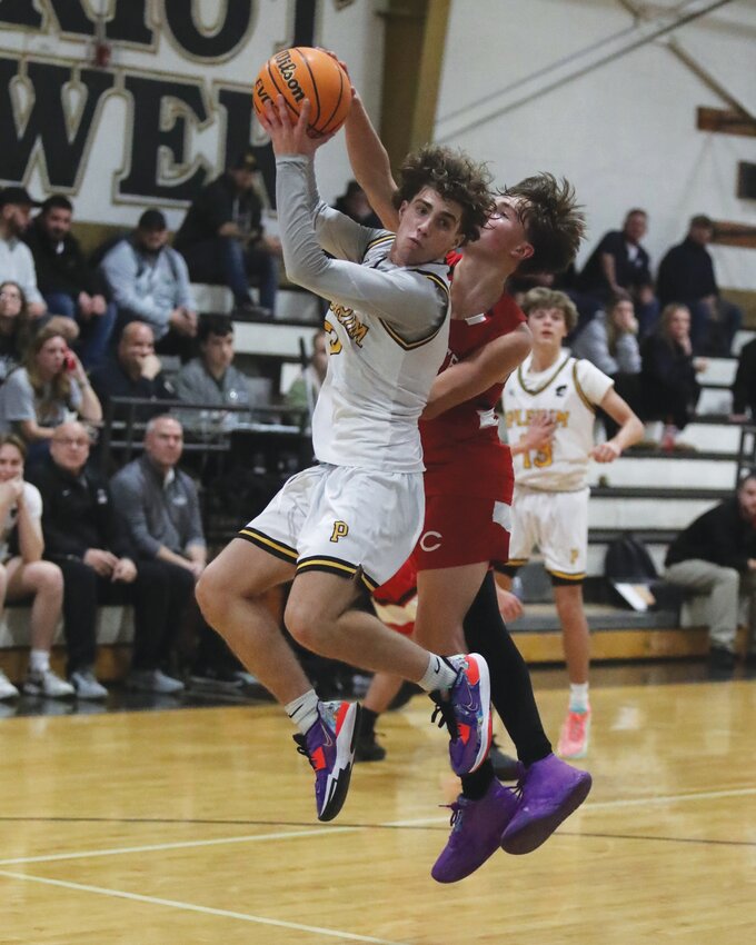 POINT GUARD: Pilgrim point guard Dylan Vale hauls in a rebound. (Photos by Mike Zawistoski)