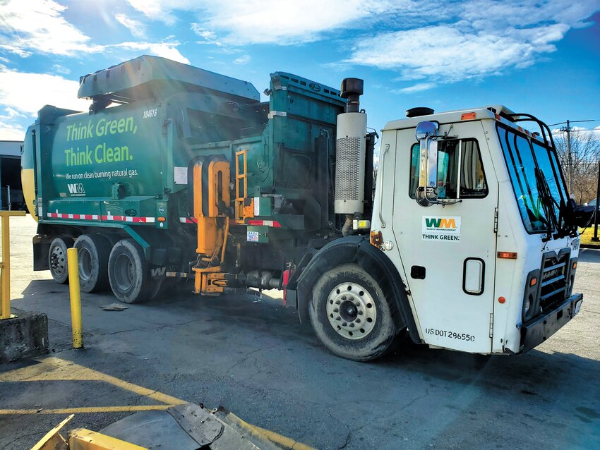 PART OF THE FLEET: One of Waste Management&rsquo;s garbage trucks parked in the Cranston Waste Management depot. (Photo by Kevin Fitzpatrick)