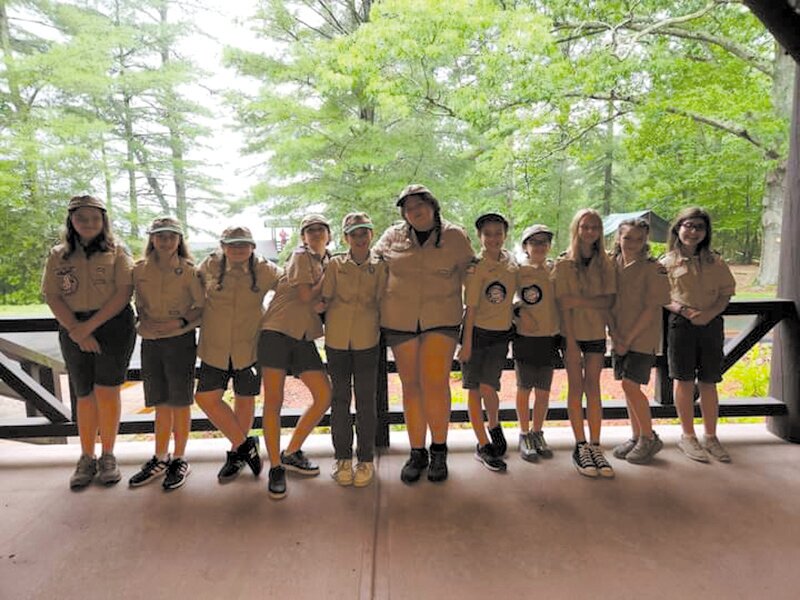 SCOUTING GALS: The young women of Troop 77 Buttonwoods, line up for photo and are pictured at one of the troop&rsquo;s activities. (Photos courtesy of Michael Mulholland)