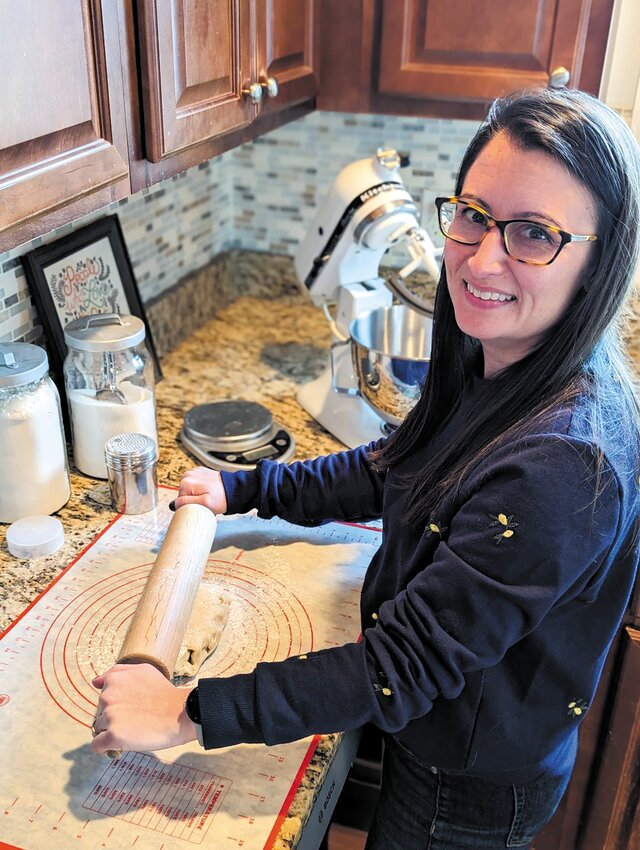 BAKING THE DAY AWAY: Sarah Larson in her kitchen in Cranston baking some sweet treats.