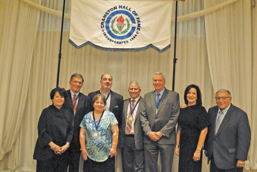 CLASS OF 2023: Cranston Hall of Fame President, Cindy Soccio left stands with the five inductees and Cranston School Department Superintendent Jeannine Nota-Masse (second from right) and School Committee chair and former Mayor Michael Traficante (right). (Photo by Steve Popiel)