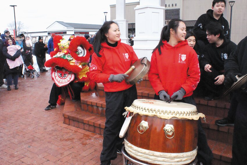 SETTING THE TEMPO: Students from Rhode Island Kung Fu Club accompanied the lion dancers on drums and chimes.