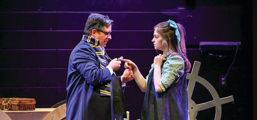 Lord Aster (Rich Canedo) gives Molly Aster (Angelina Manfredi) an amulet.