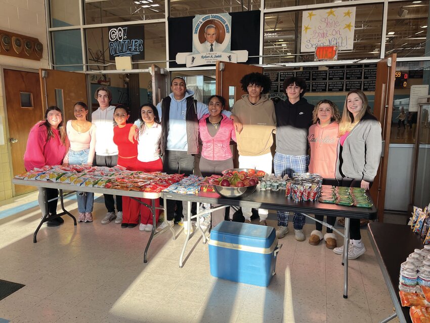 HEALTHY HELPERS: Among those JHS students who helped make Hoops for Heart another overwhelming success are standing behind a table that was filled with snacks for all participants. The group includes: Sydney Raposo, Dariana Munoz, Chris Civetti, Jiana Mitsoulis, Alessandra Pesare, Neari Vasquez, Raylin Santos, Cameron Walker, James Pastore, Kaylee Poole and Elise Connors. (Submitted photo)