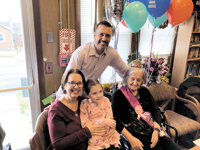 FOUR GENERATIONS: Ele Nora (right) celebrates her milestone birthday with daughter Diana Tenry (left), grandson Tony James (back) and granddaughter Arya James (center).