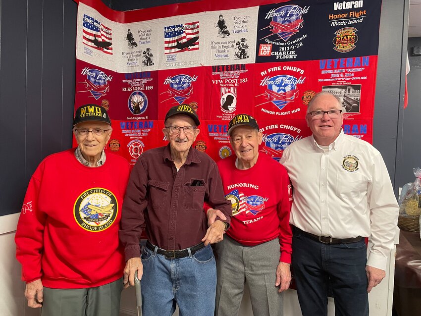 CANNOT THANK YOU ENOUGH FOR YOUR SERVICE: Left to right, Louis Giarrusso 100, Norm Parent 100, Domenic Giarrusso 101 years old, and George Farrell pose in front of the Honor Flight quilt at the fundraiser on Sunday, March 3. (Photo by Pam Schiff)